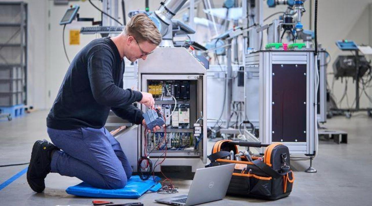 Diagnostics being run from a laptop connected to equipment